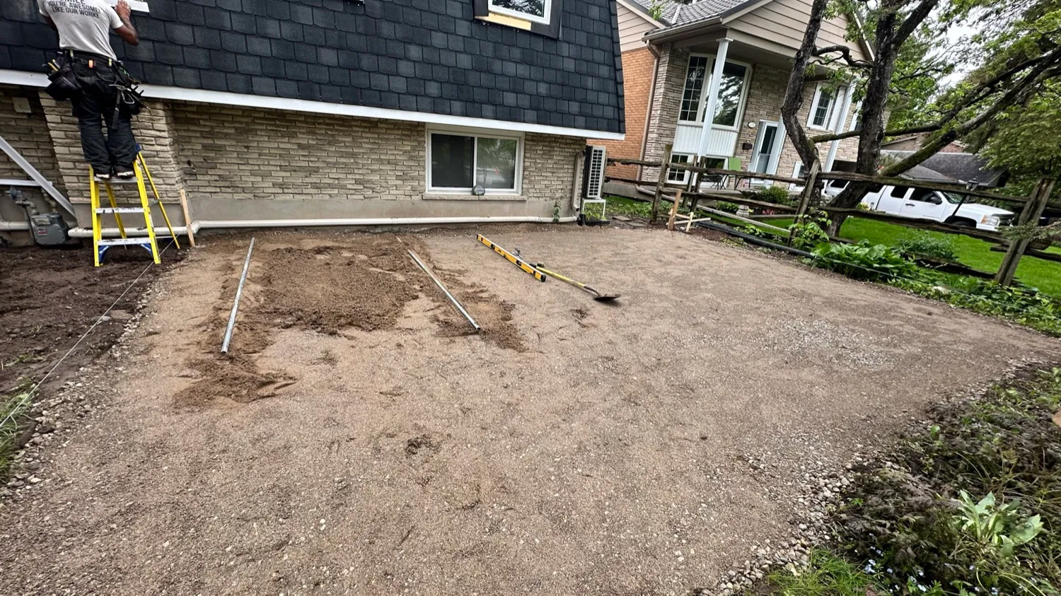 Bare dirt yard before interlocking patio installation